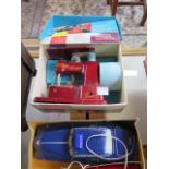 A Welsotoys model 141 battery police car and Vulcan Senior childs sewing machine