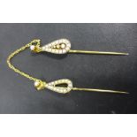 A gold, diamond and seed pearl double scarf pin, the twin tear shape pendants set with seed pearls