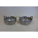 A pair of 18th century pre French Revolution armorial silver bon-bon dishes decorated with birds and