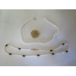 A string of cultured pearls, with 14ct gold clasp, pearls approx 6mm diameter, necklace 45cm in