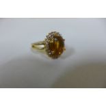 A 19ct yellow gold diamond and citrine ring, citrine size approx 11x9mm, ring size M, approx 6.7