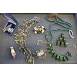 A collection of assorted vintage jewellery including a Cinnibar brooch, Moschino necklace