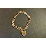 A 9ct rose gold hollow link bracelet with heart shape clasp, weight approx 7 grams - stamped 9ct