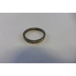 A white metal eternity ring set with small diamonds, size Q, approx 3.2 grams, some general usage