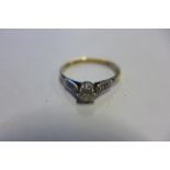 An 18ct yellow gold solitaire diamond ring, size S, approx 2.6 grams, some wear consistent with use,