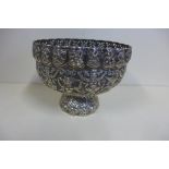 A 19th century Thai silver stem bowl decorated with mythical animals and beings, height 13.5cm,