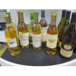 Twelve bottles of assorted white wine, including Casa Nueva, Sauternes, Baron Philippe, Wooded