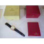 A Gents Omega Geneve wristwatch with gold plated case, silvered dial with baton markers and