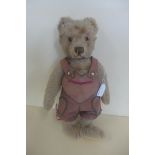 A Steiff bear, circa 1952-70 - 32cm tall, button in ear with remains of yellow tag, pads good