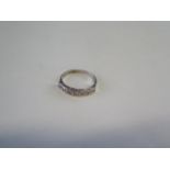 An 18ct hallmarked white gold diamond ring, size O, approx 3.6 grams, diamonds bright, some