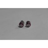 A pair of ruby and diamond earrings set in 18ct white gold, approx 2.8 grams, in good condition