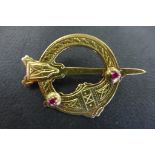 A 14ct gold Irish Celtic style brooch set with two small rubies, approx weight 8.3 grams, widest