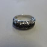 A 9ct white gold black and white diamond ring, size T, approx 4 grams, generally good