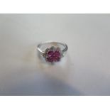 A 14ct white gold four stone ruby and diamond ring, size N, approx 2.9 grams, in good condition