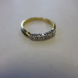 An 18ct yellow gold, seven stone diamond ring, size Q, approx 3.1 grams - in generally good