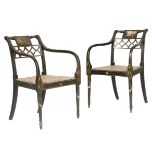 A pair of Regency ebonised and painted open armchairs, each with a tablet back, one painted with a