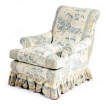 A late Victorian easy armchair, upholstered with peacocks and pines material by Warner & Sons, on