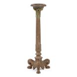 A 19th century cast iron torchere, the top with a wooden insert, above a gilt capital, on a plain