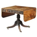 A Regency mahogany sofa table, the flame veneered drop-leaf top above a pair of cedar lined long