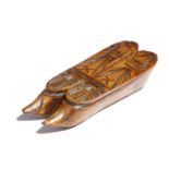 A 19th century treen chip carved double shoe snuff box, the sliding cover decorated with a pair of