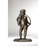 A mid-19th century bronze figure of a boy, blowing his hunting horn and with a deer draped over