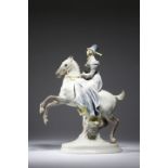 A German porcelain equestrian group by Lorenz Hutschen Reuther, depicting a lady riding side