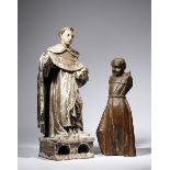 A Spanish carved wood and polychrome figure of a saint, with traces of parcel gilt decoration and