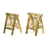 A pair of Victorian brass coffin stands, of hinged easel form, with scroll work panels, 58.2cm high,