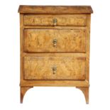 An Italian walnut chest, with burr veneered panels and fitted with three drawers, on bracket feet,