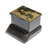 A late 19th century Russian black lacquer papier-mache cigarette box by Lukutin, the hinged lid