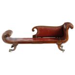 λ A Regency rosewood and brass marquetry inlaid scroll end day bed, later upholstered with