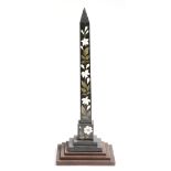 A Victorian Derbyshire Ashford pietra dura obelisk, inlaid with lilies, on a part wood stepped base,