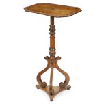 A Regency mahogany occasional table, inlaid with ebonised stringing, the rectangular tilt-top with
