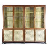 A Regency mahogany bookcase, with ebonised edging, the reeded cornice with a plain frieze, above