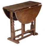 A William and Mary oak gateleg table, the oval drop-leaf top on block and spiral twist ends, the