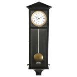 A small Vienna regulator style wall clock, the brass five day movement with an enamel dial with