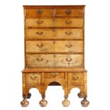 A George II and later walnut chest on stand, with two short and four long drawers, the stand