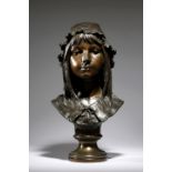 Emil Namur (Belgian 1852-1905). A bronze bust of a young girl, wearing a hat, signed 'Em. Namur' and
