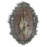 An Austrian cold painted bronze dead game wall plaque, modelled with three birds, including a