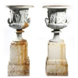 After the antique. A pair of Victorian painted cast iron Medici and Borghese garden urns, each