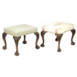 Two similar walnut stools in George II style, each with a stuffed-over seat, on leaf capped cabriole