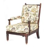 λ A George IV rosewood bobbin turned armchair in the manner of Gillows, originally on castors.