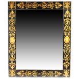 A Regency ebonised and painted wall mirror, the rectangular plate within a frame decorated with