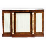 λ A Regency rosewood breakfront side cabinet, the Carrara marble top above a plain frieze