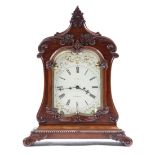 A George IV mahogany mantel clock by Roskell of Liverpool, the eight day brass movement with four