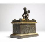 An early 19th century French classical gilt and patinated bronze Grand Tour inkstand, of sarcophagus