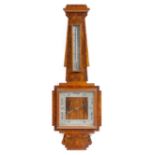 An Art Deco walnut barometer, with a silvered dial and thermometer, 81.4cm long. Provenance: The