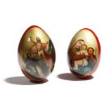 Two late 19th century Russian red lacquer papier-mache Easter eggs, one painted with a church and