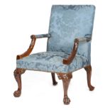 A George II red walnut library armchair, the padded back, armrests and seat covered in blue silk