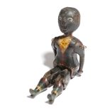 A late 19th century American folk art painted wood jig doll, in the form of a black boy, with